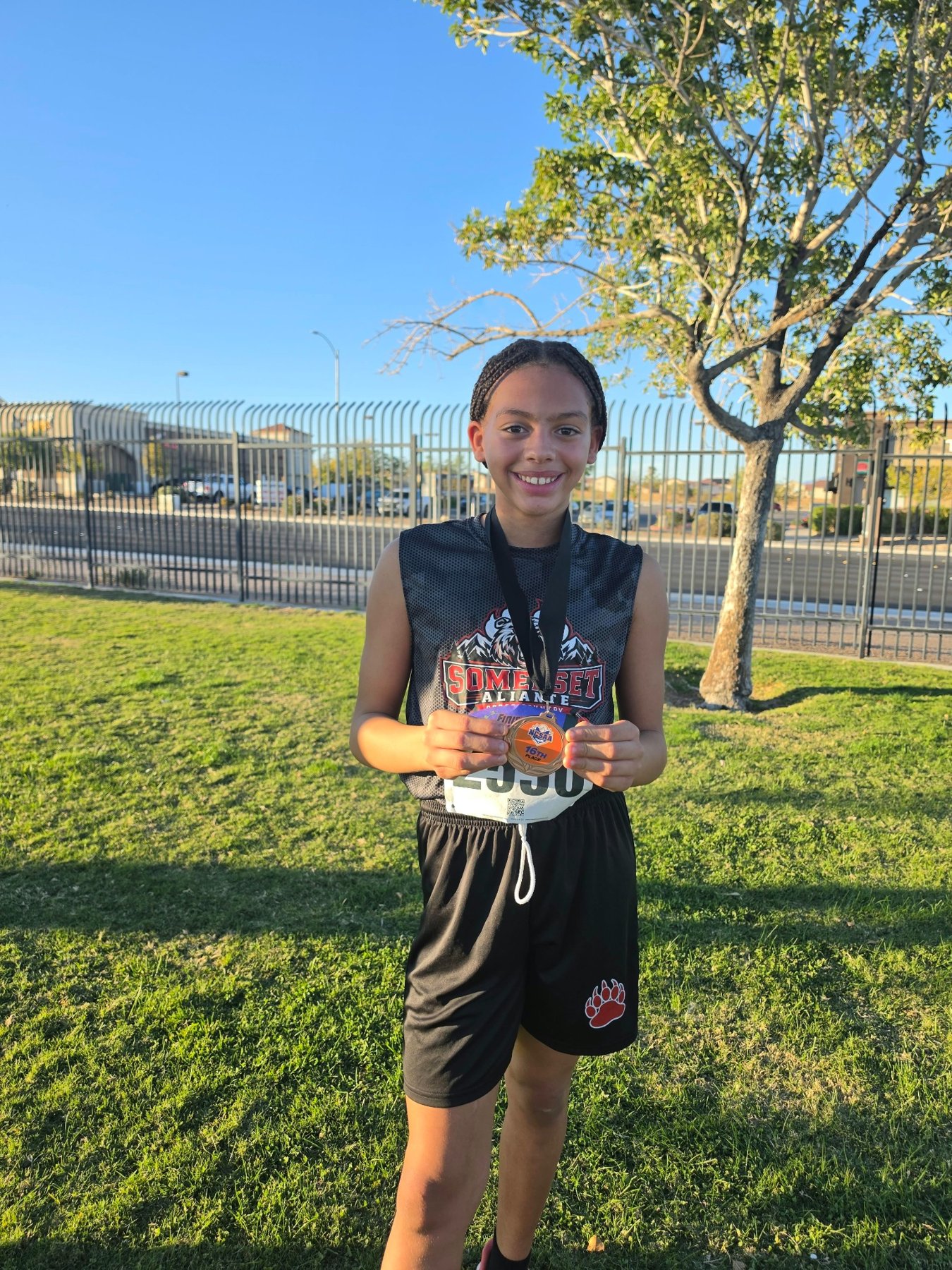 Ali displaying a race medal